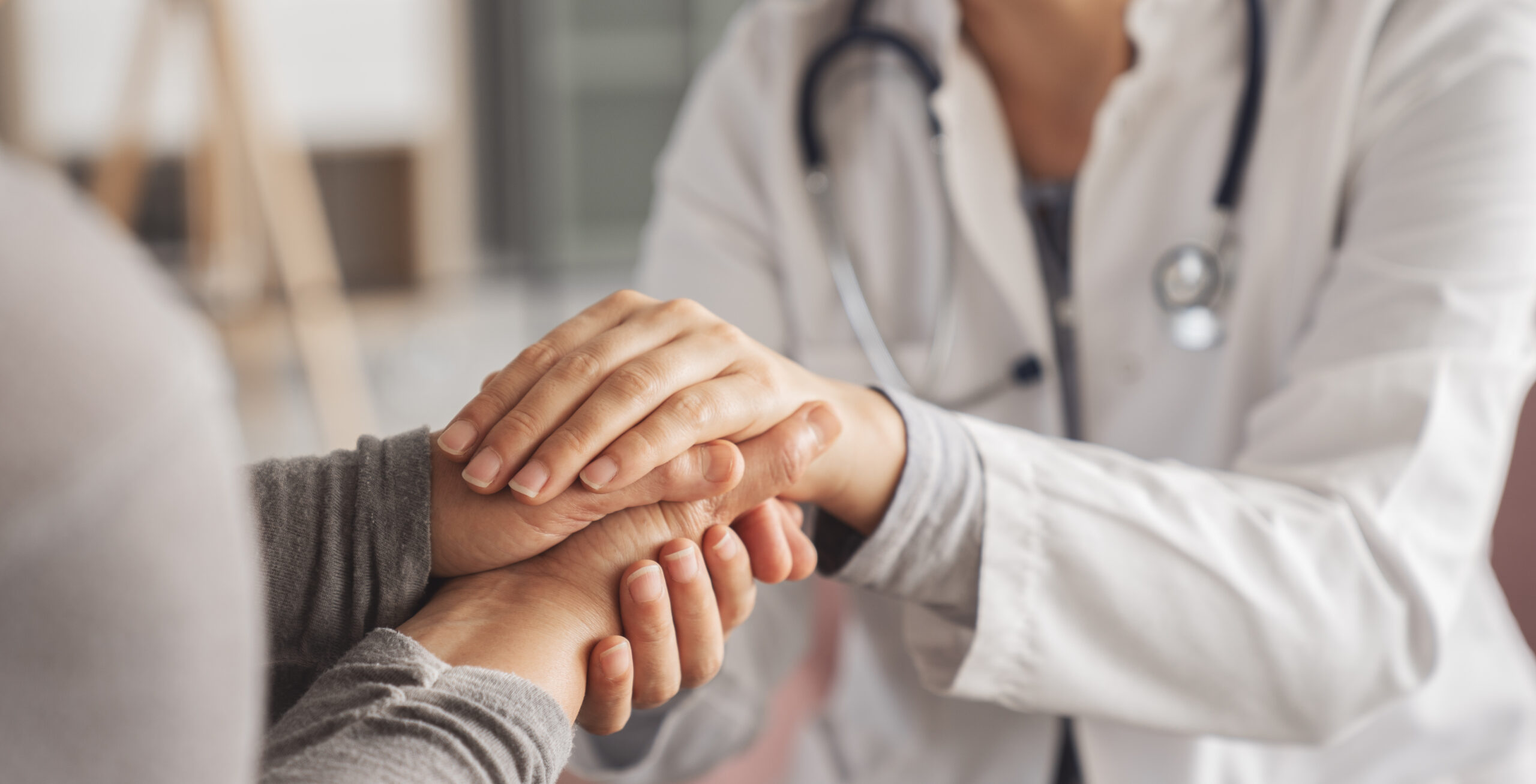 Compassionate medical professional comforting a patient during medically supervised drug and alcohol detox.